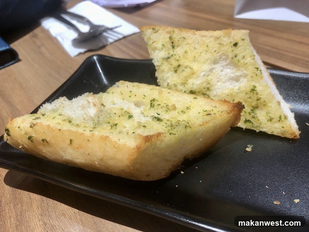 Garlic Bread on Black Plate