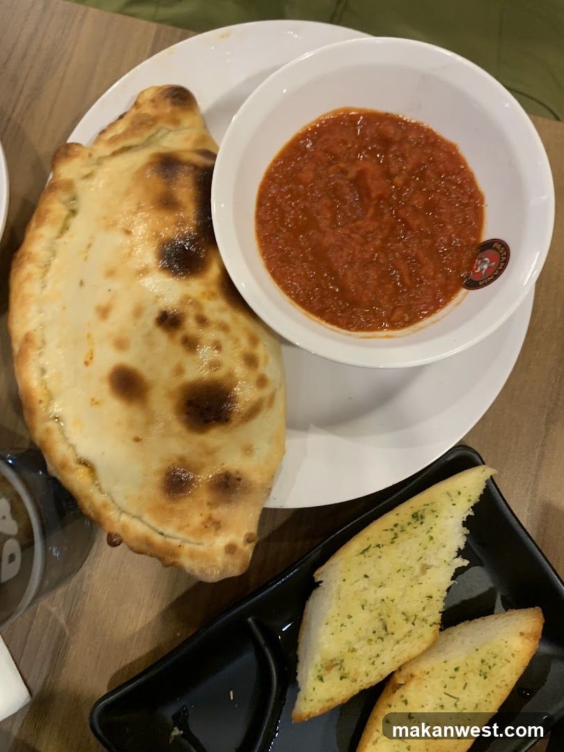 Food Plate with Calzone, Soup and Garlic Bread