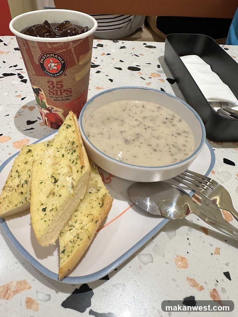 Dish with soup and garlic bread