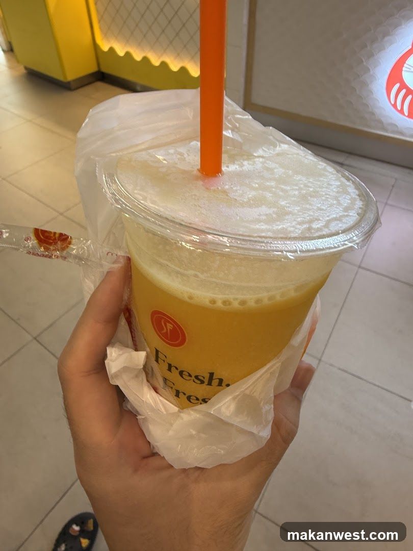 Hand holding a fresh juice drink