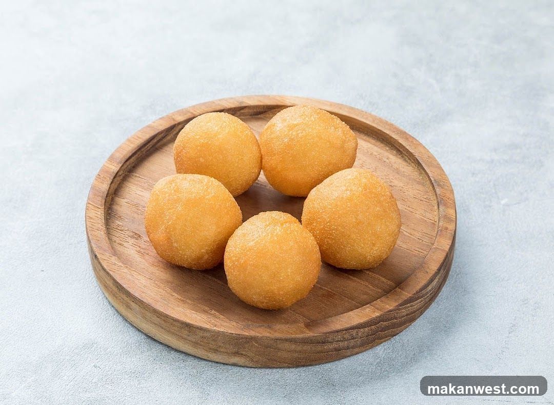 Fried Dough Balls on Wooden Plate