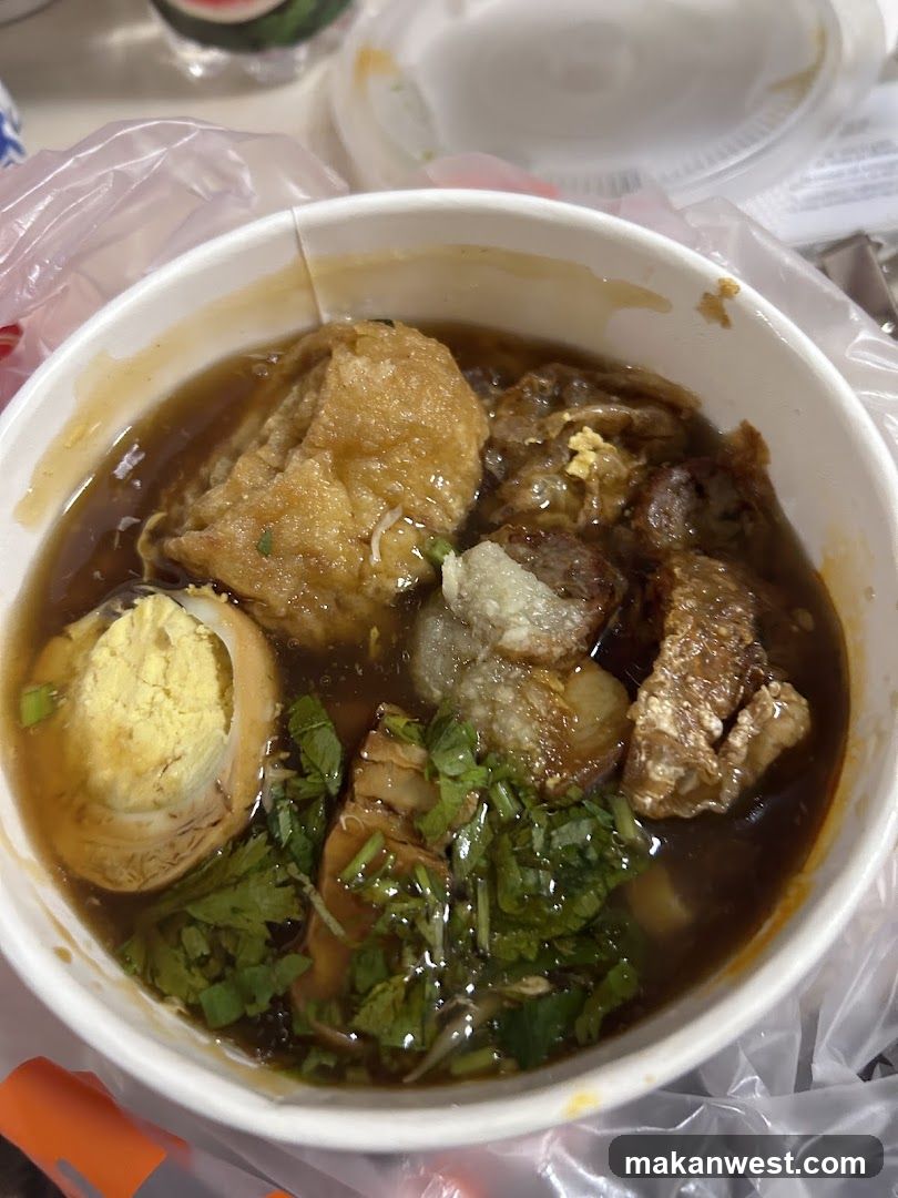 Bowl of Soup with Halved Egg and Tofu