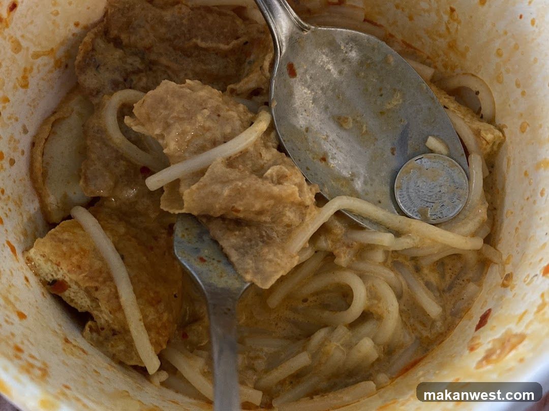 Noodle Bowl with Meat and Spoon