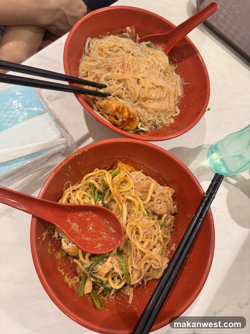 Noodle Bowls with Chopsticks and Spoons