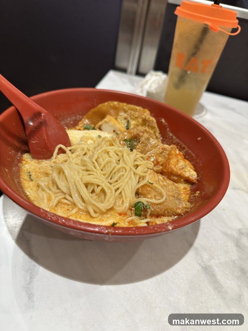 Bowl of noodles with egg and sauce