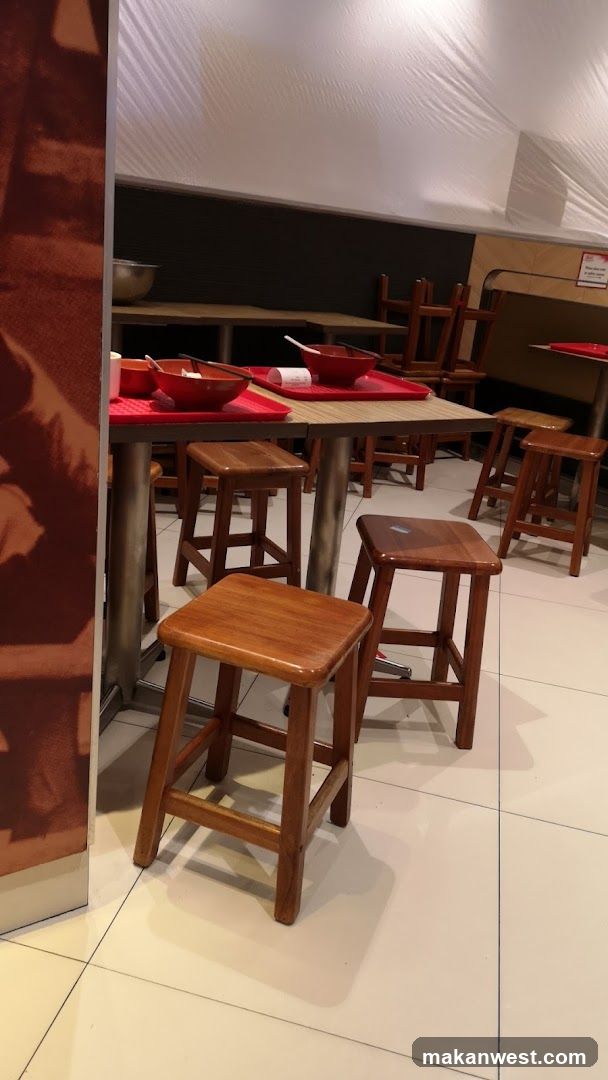 Restaurant Interior with Wooden Stools and Tables