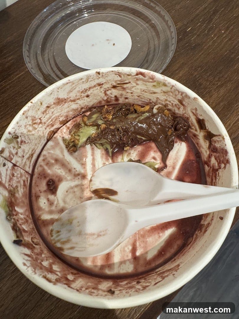 Empty food bowl with spoons