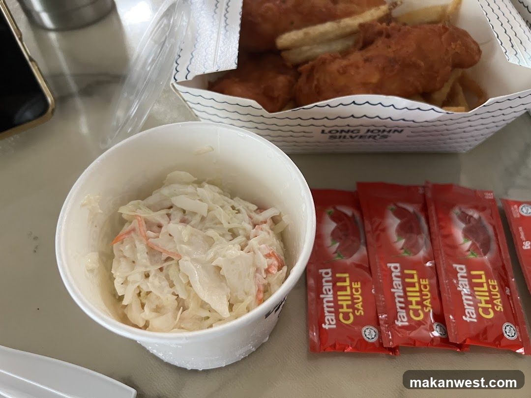 Fast Food Meal with Coleslaw and Chilli Sauce Packets