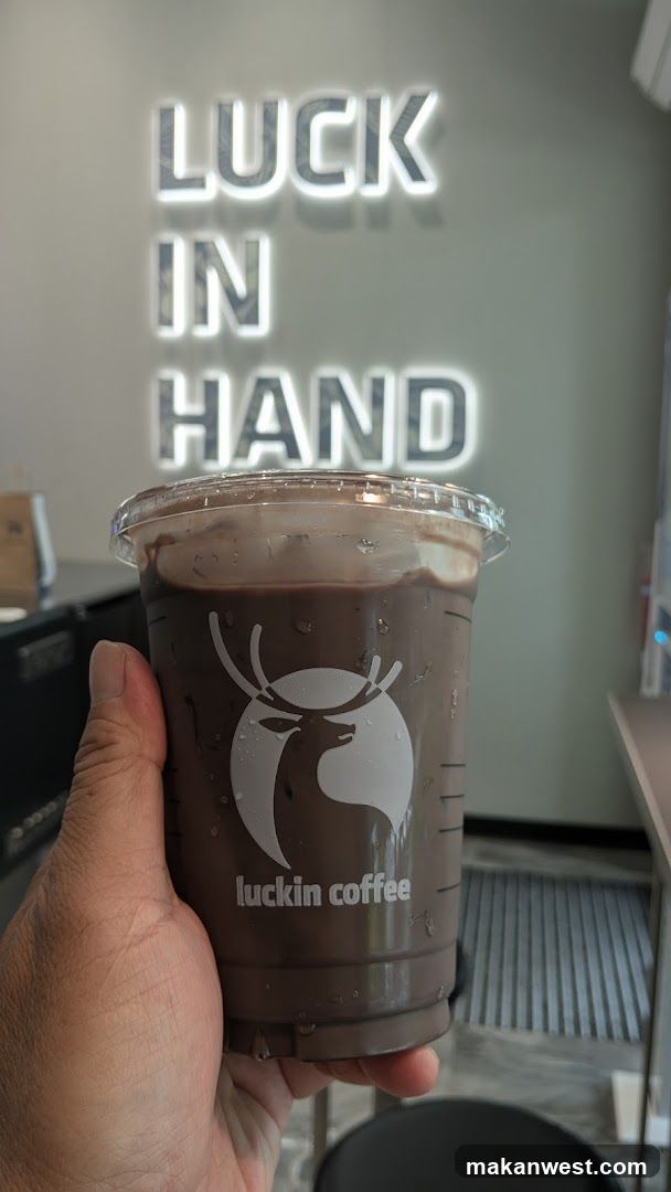 Luckin Coffee Drink with Neon Signage