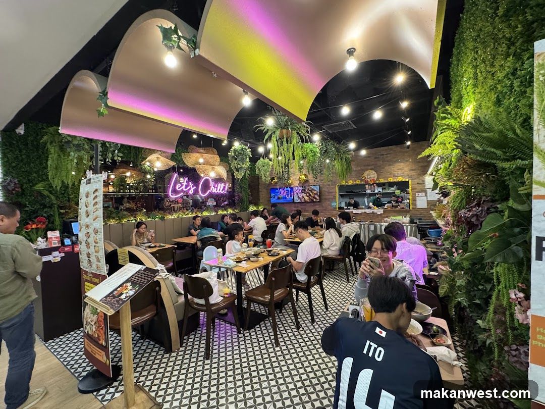 Restaurant Interior with Greenery and Neon Signage