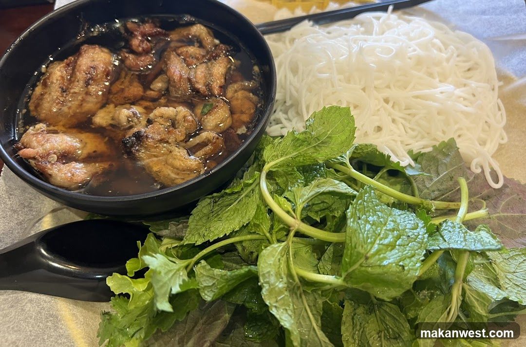 Bowl of Meat with Noodles and Herbs