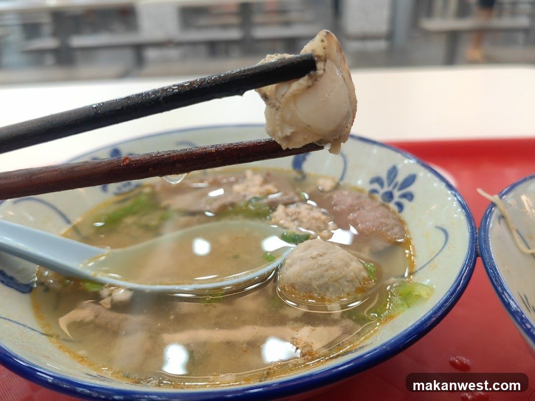 Bowl of Soup with Clam and Meatballs