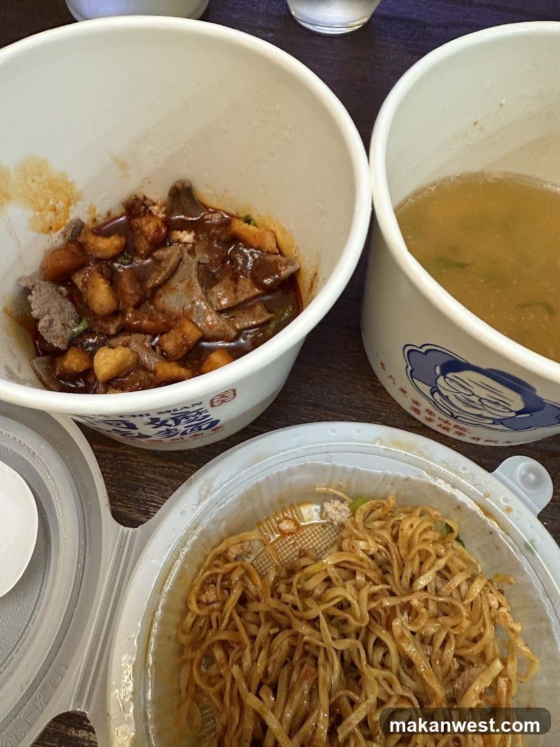 Takeout food containers with noodles and soup