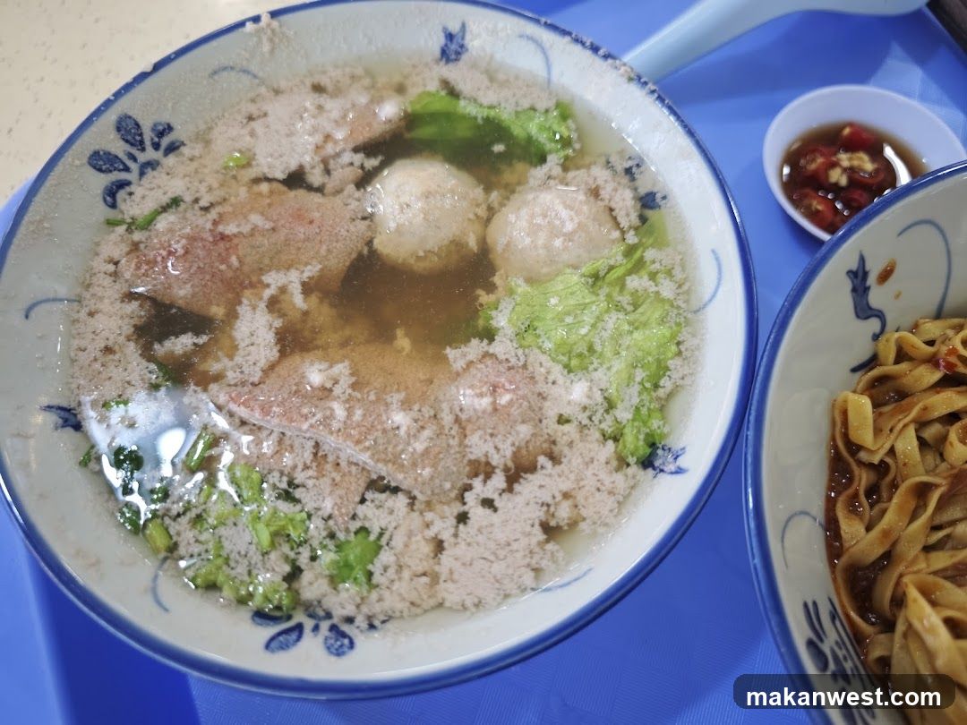 Bowl of Soup with Meatballs and Noodles