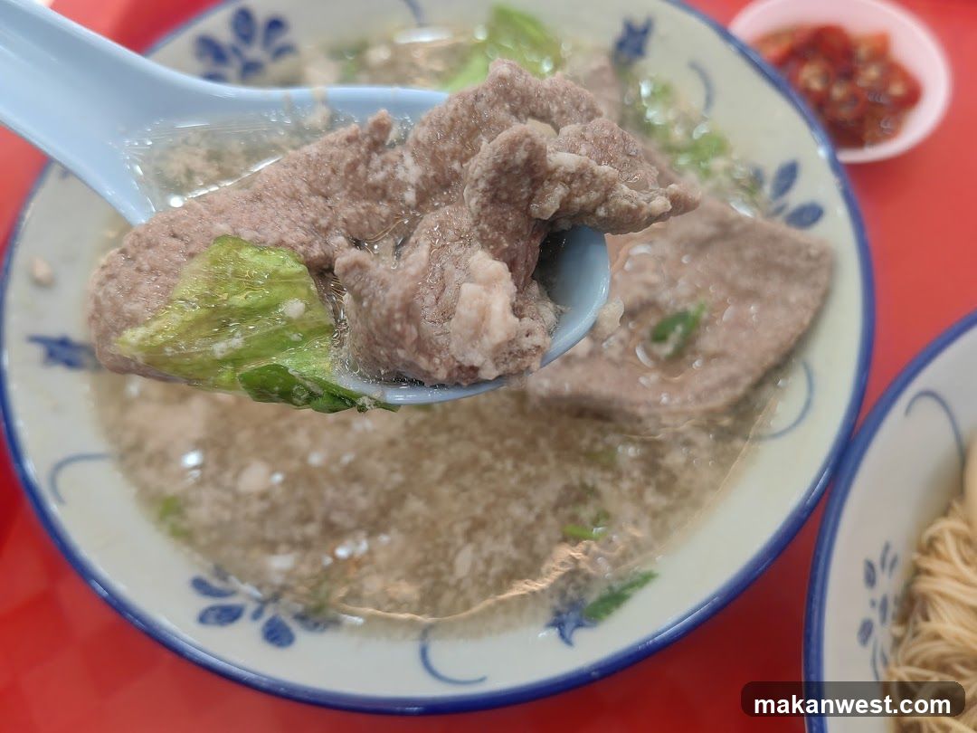 Bowl of Soup with Meat and Vegetables