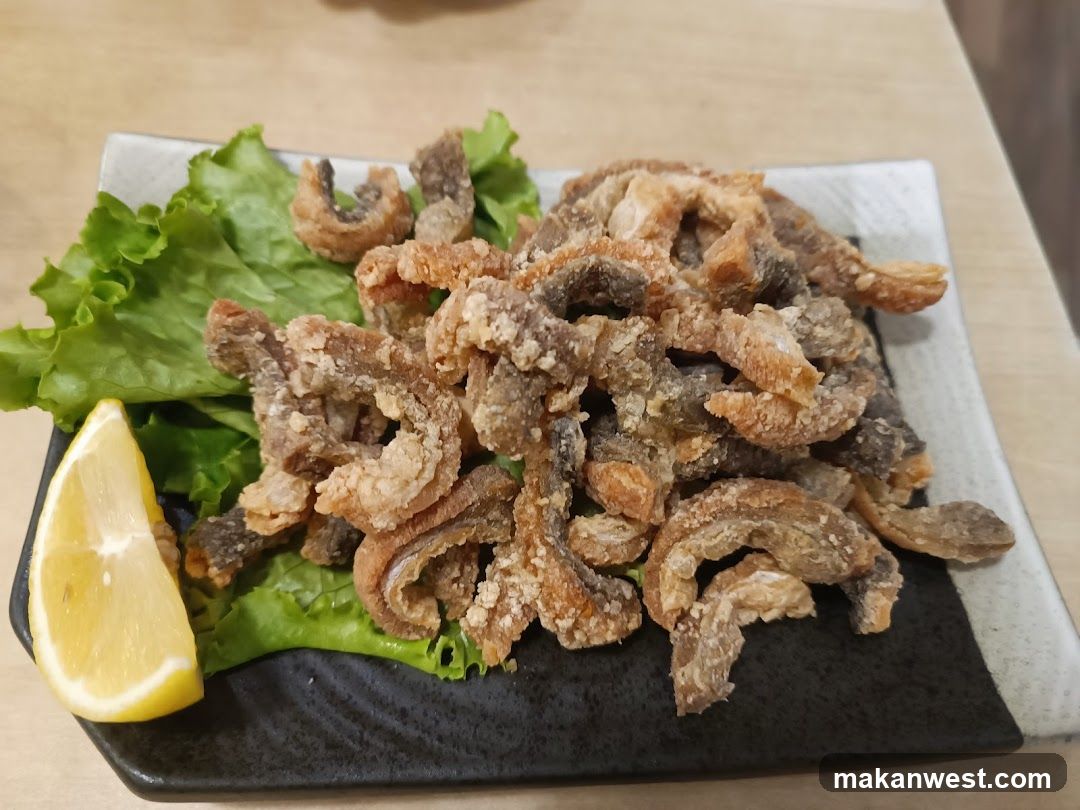 Fried Fish Snacks with Lemon and Lettuce