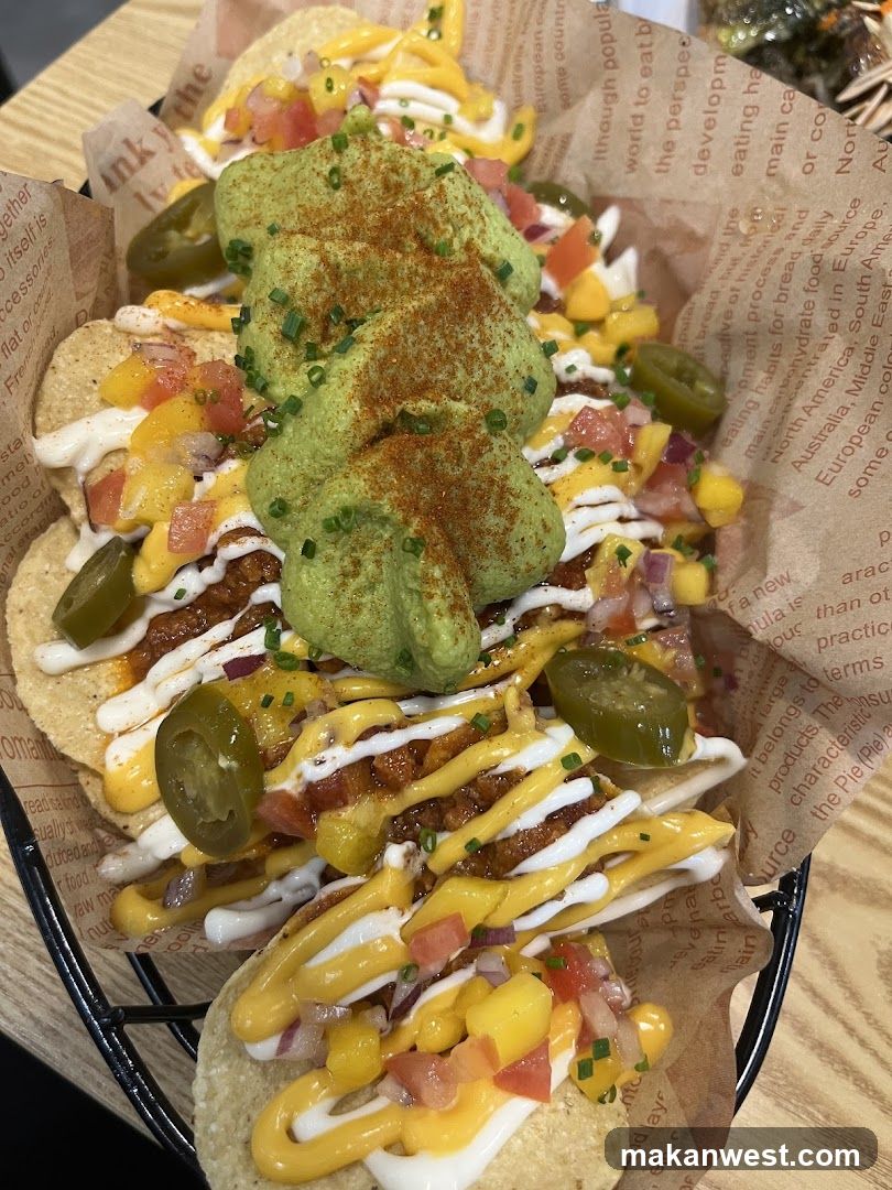Loaded Nachos with Guacamole and Jalapeños