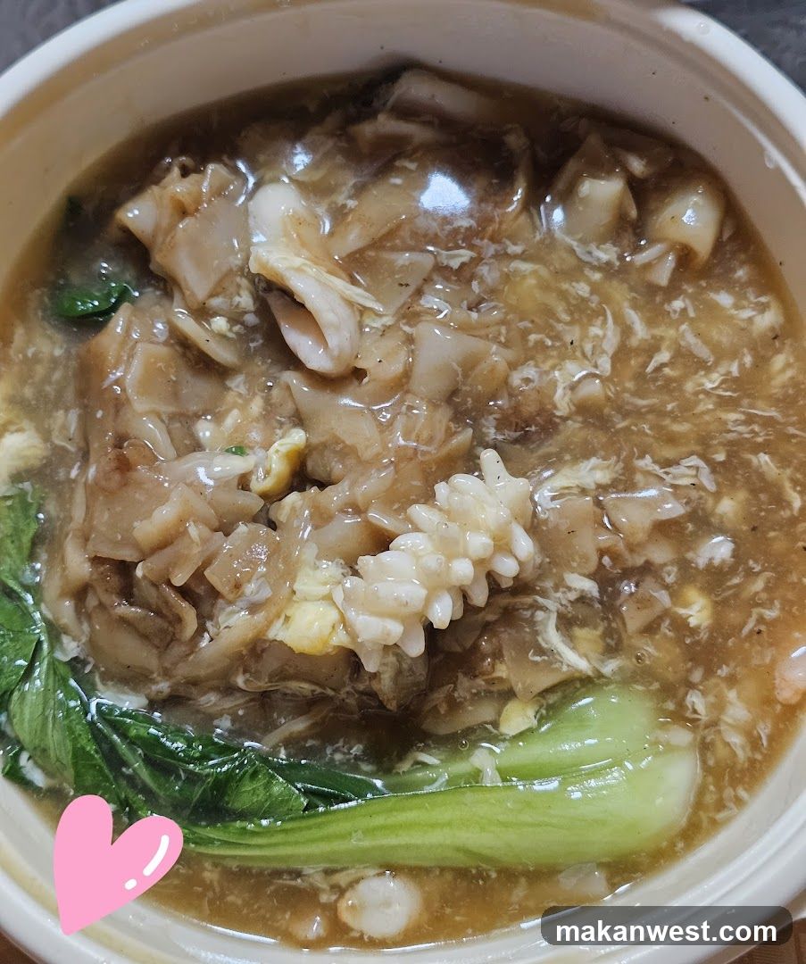 Bowl of Soup with Noodles and Greens